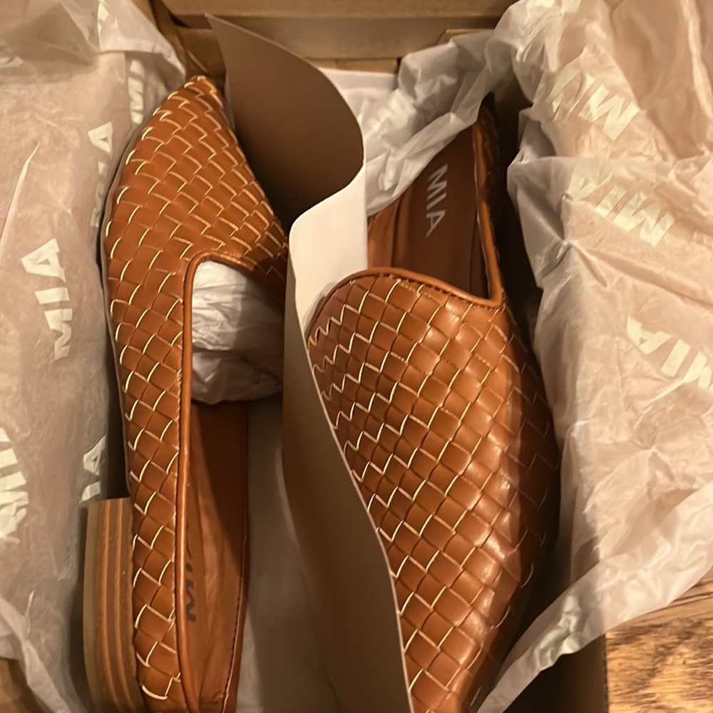 Brand new MIA tan flats.  Never worn.